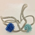 Bracelet FLOCON, no 16, de l'artiste Sandrine Giraud, Ce bijou modulable marie avec élégance la grâce et l’originalité des lignes résolument contemporaines. longueur de 8 pouces