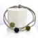 Bracelet SATELLITE FIN, no 72, de l'artiste Sandrine Giraud. Couleur gris argent et perles olive et noire. Ce bijou marie avec élégance la grâce et l’originalité des lignes.