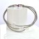 Bracelet SATELLITE FIN, no 76, de l'artiste Sandrine Giraud. Couleur gris argent et perles transparentes. Ce bijou marie avec élégance la grâce et l’originalité des lignes.