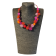 Collier ESCARGOT FLOCON, no 175, de l'artiste Sandrine Giraud, couleur, rose, rouge, orange. Ce bijou toujours original, marie avec élégance la grâce et l’originalité des lignes.