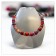 Collier POLARIS, no 154, de l'artiste Sandrine Giraud, couleur, argent, perles roses, rouges, oranges. Ce bijou toujours original, marie avec élégance la grâce et l’originalité des lignes. contexte