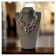 Collier RC-CERTI, no 187, de l'artiste Sandrine Giraud, couleur, argent, perles rouges. Ce bijou modulable, toujours original, marie avec élégance la grâce et l’originalité des lignes. contexte
